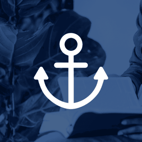 A white anchor icon overlaid on a deep blue background with a blurred image of a person reading a book.