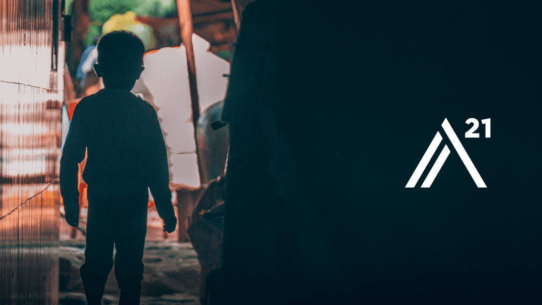 Silhouette of a child walking beside the A21 logo.
