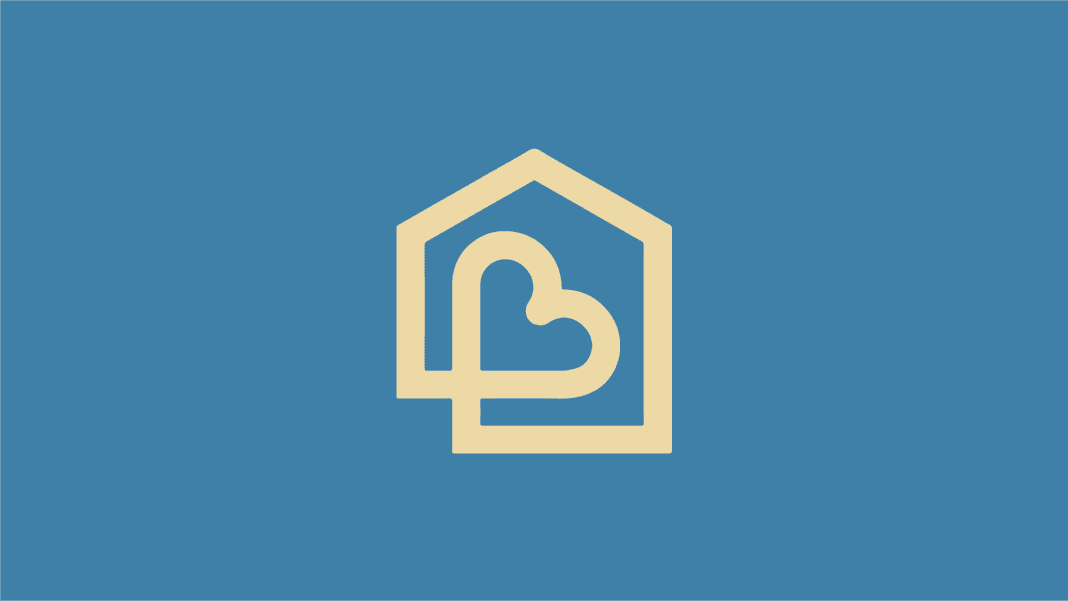 A beige heart-shaped design within a house outline appears on a blue background.