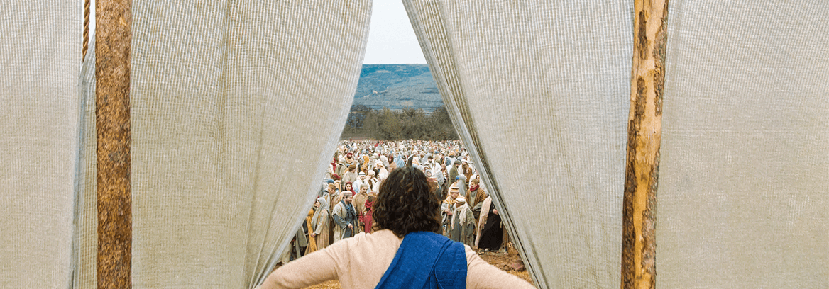View from behind Jesus as he parts curtains and sees a large crowd in the distance.